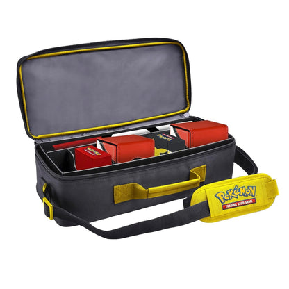 Black carrying case with yellow accents featuring a Pokémon logo, open to reveal red boxes inside.